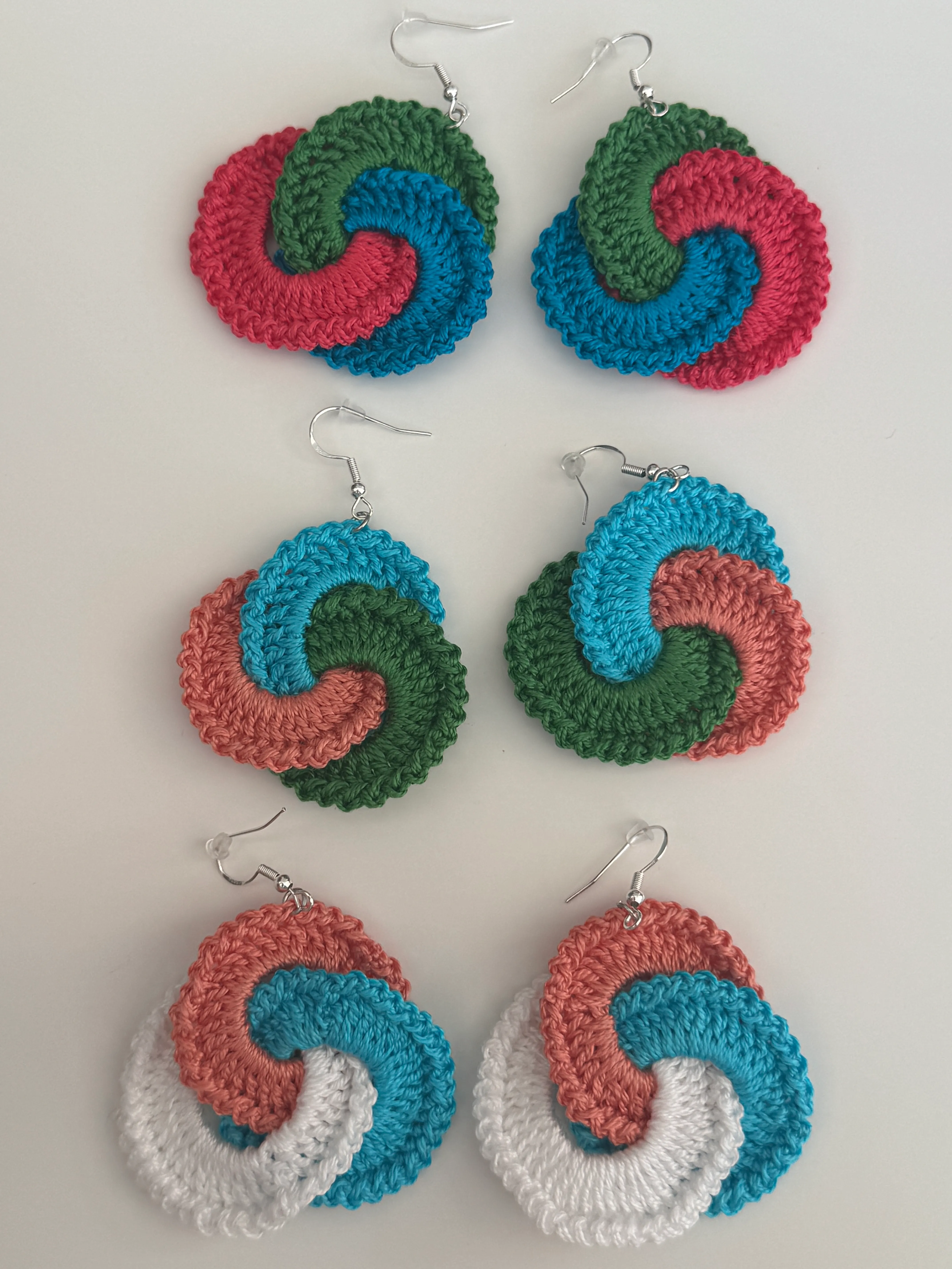 KUMAI Swirl Drops - three colourways on a flat-lay